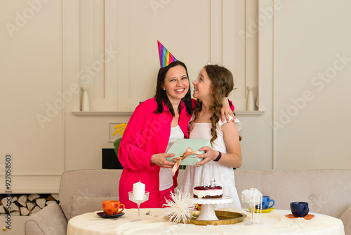 Birthday girl ishares moment with mother photo