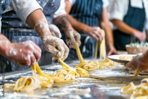 Middle-Aged Friends in Cooking Class Making Homemade Pasta with Chef Guidance photo