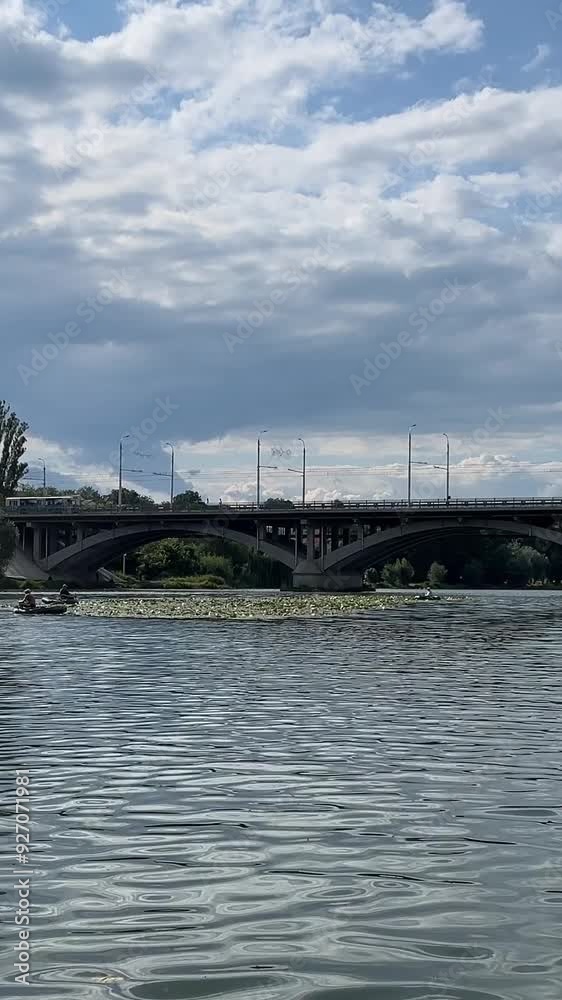 Southern Bug River Ukraine Vinnitsa. Traveling on a yacht under bridges, sailing, making wishes. Float along the river view from the river to the city Southern Bug River Ukraine Vinnitsa. Traveling on a yacht under bridges, sailing, making wishes. Float along the river view from the river to the city