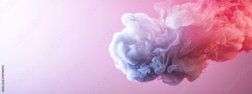  A pink backdrop holds a swirl of red and pink liquid suspended in the air At its heart, a red and white smoke trail unfurls