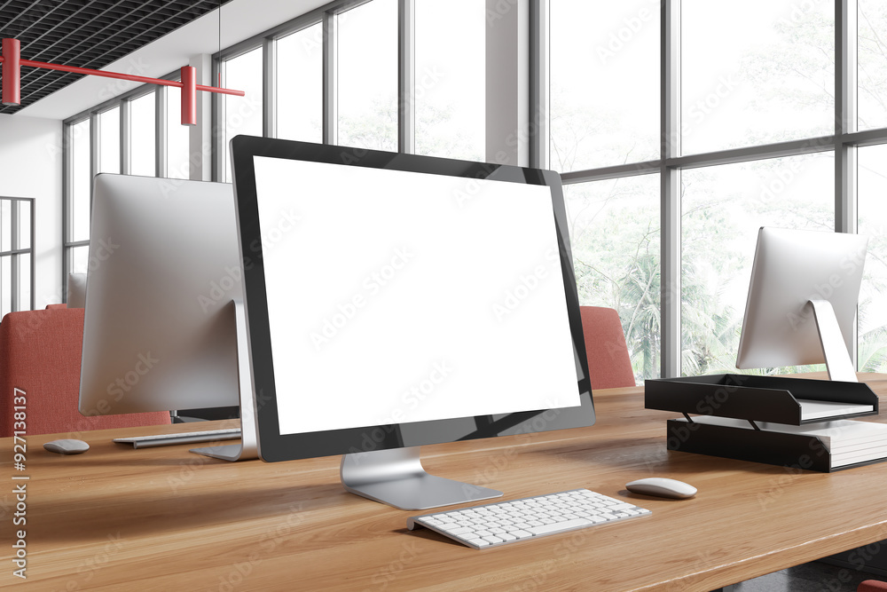 Fototapeta premium Office coworking interior with pc computer mockup display on table