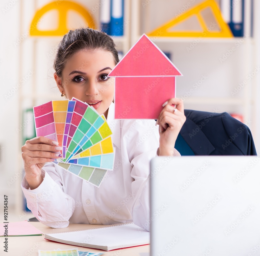 Female beautiful designer working in the office Female beautiful designer working in the office