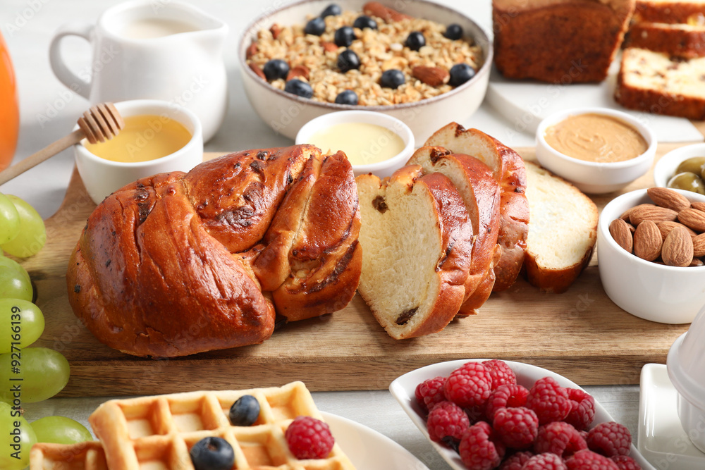 Different meals served for breakfast on white table Different meals served for breakfast on white table