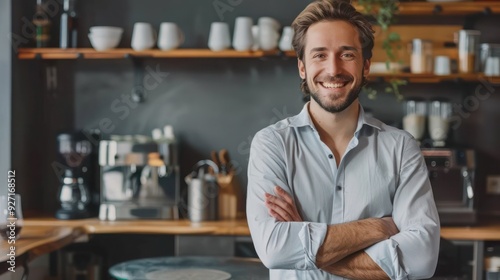 Happy entrepreneur enjoying in coffee break at office kitchen and looking at camera. 