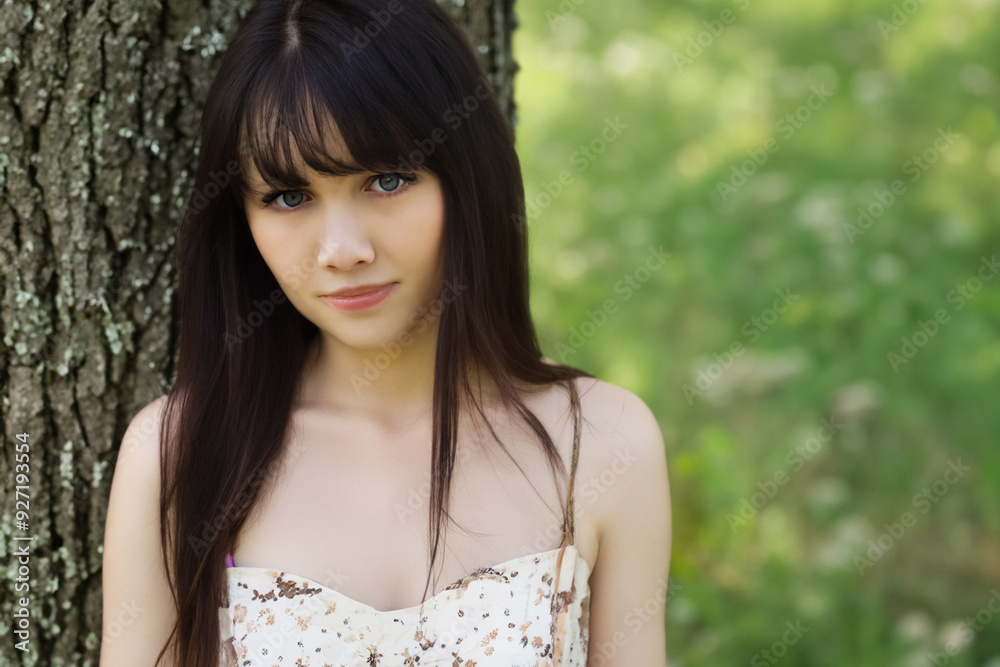 A girl a dress nature with trees. flower concept. a girl in green dresses is surrounded by trees in nature. a girl in green and white dress in nature lifestyle. A girl a dress nature with trees. flower concept. a girl in green dresses is surrounded by trees in nature. a girl in green and white dress in nature lifestyle.