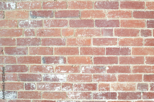 Textured red brick wall with white wash