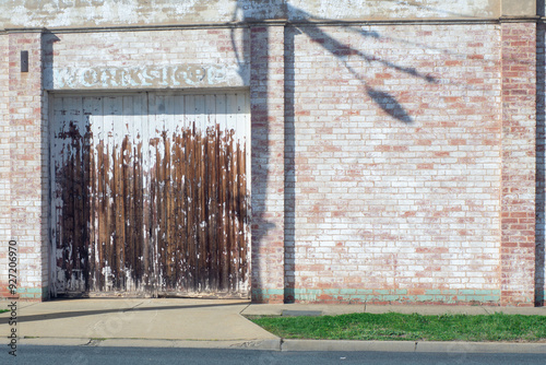 The side of an abandoned building with weathered paint