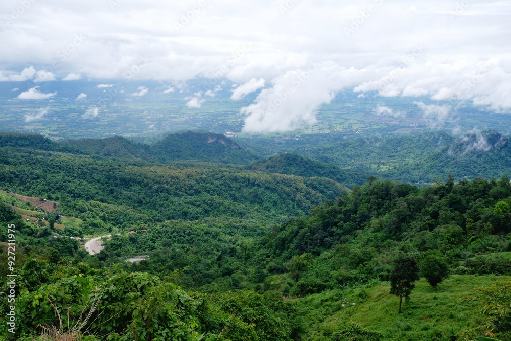 Fototapeta premium View from the top, seeing the sky, mountains and wide forests.