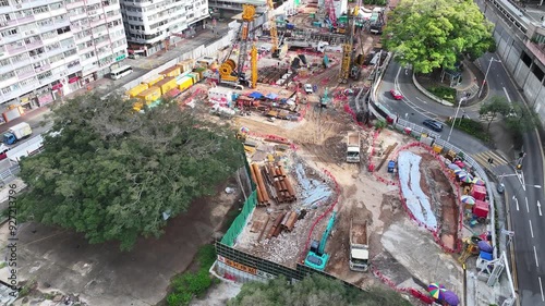 Hong Kong Kowloon Mong Kok railway station construction redevelopment near Sai Yee Street Argyle Street,building a towering green commercial skyscraper, showcasing urban innovation and architectural photo