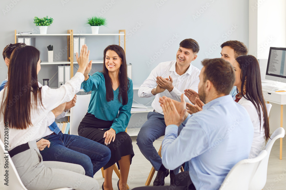 Positive business team is conducting a teamwork group meeting, colleagues giving high five, celebrating success and agreement. People collaborative spirit and dedication to achieving common goals. Positive business team is conducting a teamwork group meeting, colleagues giving high five, celebrating success and agreement. People collaborative spirit and dedication to achieving common goals.