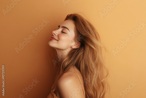 A close up of a woman's face with her eyes closed and long blond hair