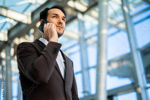 Businessman talking on the phone in a modern office building