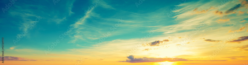 Sunset over the seashore with concrete embankment and small pier Sunset over the seashore with concrete embankment and small pier