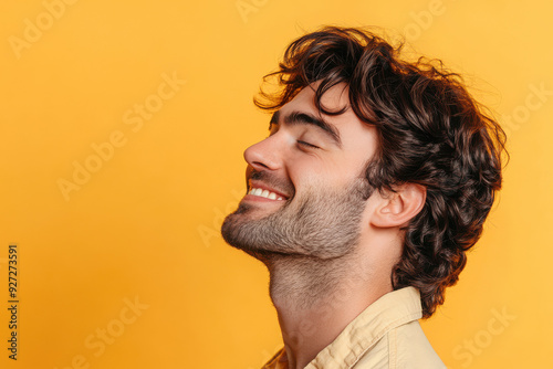 A close up of a man's face with her eyes closed