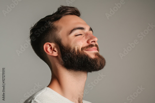 A close up of a man's face with her eyes closed