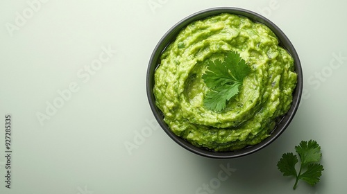 Guacamole Delight: Cilantro Garnish on Green Background