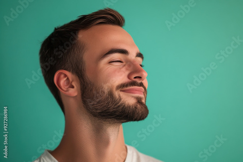 A close up of a man's face with her eyes closed