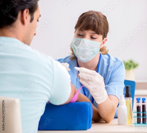 Young patient during blood test sampling procedure