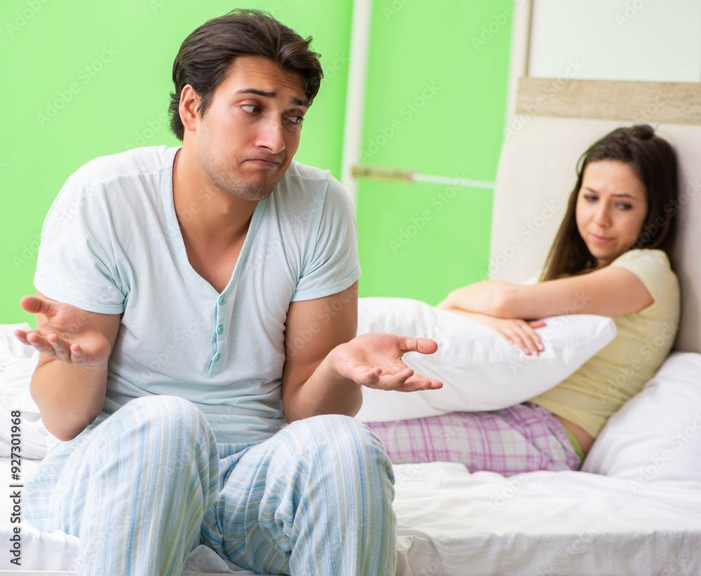 Woman and man in the bedroom after conflict