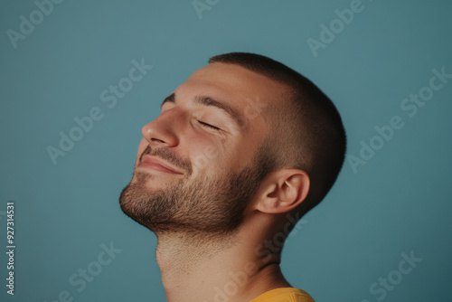 A close up of a man's face with her eyes closed