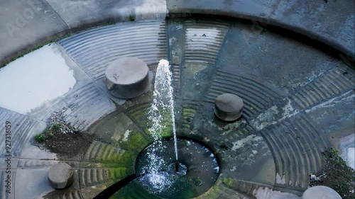 Slow motion aerial footage of the spillway of Lake Lenexa in daytime in Black Hoof Park, Kansas, USA photo