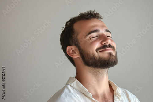 A close up of a man's face with her eyes closed