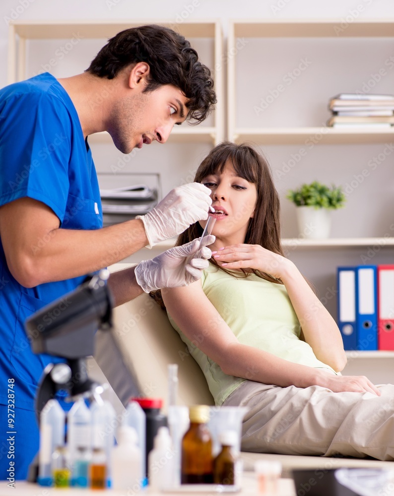 Doctor getting saliva test sample in clinic hospital