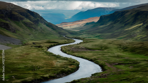 A winding river cutting through A verdant valley