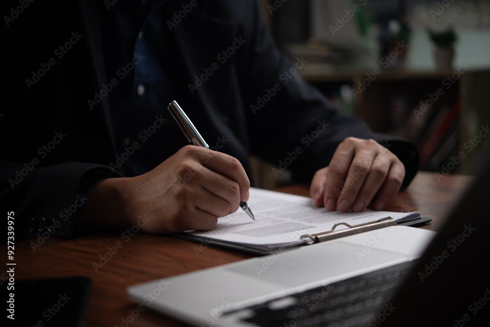 Close-up of a businessperson signing a contract with a pen, evoking professionalism and commitment. Close-up of a businessperson signing a contract with a pen, evoking professionalism and commitment.