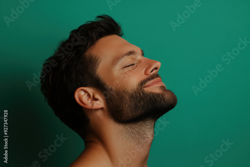 A close up of a man's face with her eyes closed