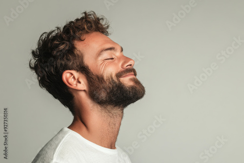 A close up of a man's face with her eyes closed