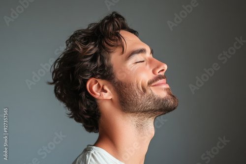 A close up of a man's face with her eyes closed