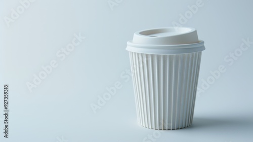 Wallpaper Mural White paper coffee cup with plastic lid standing on blue background with copy space Torontodigital.ca