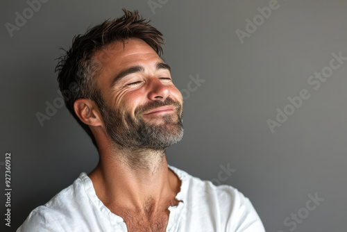 A close up of a man's face with her eyes closed