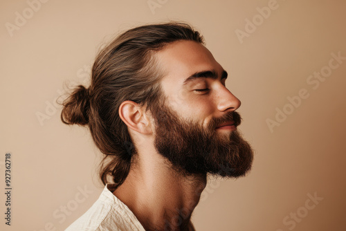 A close up of a man's face with her eyes closed