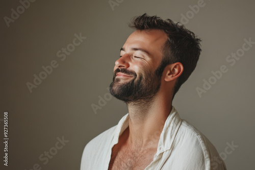 A close up of a man's face with her eyes closed