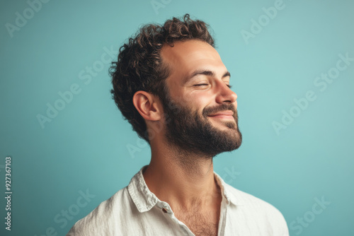 A close up of a man's face with her eyes closed