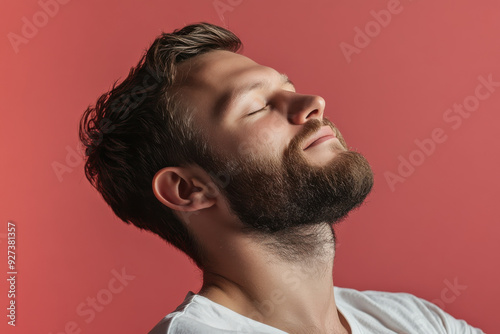 A close up of a man's face with her eyes closed