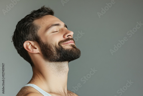 A close up of a man's face with her eyes closed