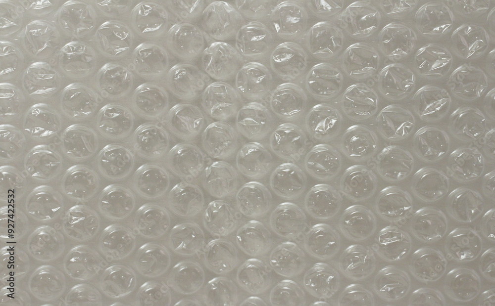 Close up of transparent white bubble wrap background. Texture of bubble wrap for packaging. Close up of transparent white bubble wrap background. Texture of bubble wrap for packaging.
