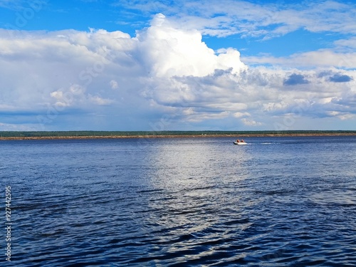 beautiful view of the river and people sailing on a boat