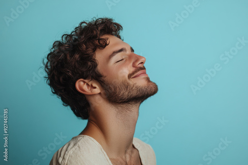 A close up of a man's face with her eyes closed