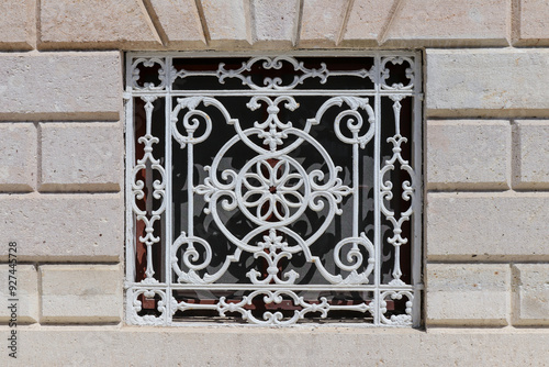 Forged architectural details - figured lattice painted white photo