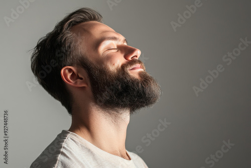 A close up of a man's face with her eyes closed