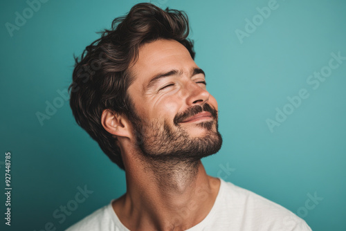 A close up of a man's face with her eyes closed