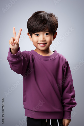 young Asian kid wearing a purple outfit, isolated on a white isolated background