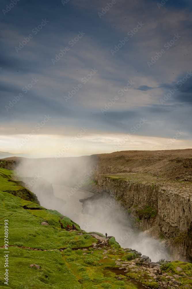 Water spray over Detifoss waterfall with wildflowers Water spray over Detifoss waterfall with wildflowers