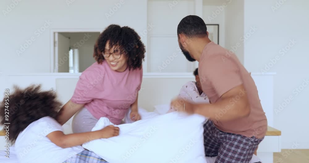 Pillow fight, parents and family of children in bedroom for funny games, joke or freedom together. Excited mother, father and tickle playful kids with cushions for crazy energy in the morning at home Pillow fight, parents and family of children in bedroom for funny games, joke or freedom together. Excited mother, father and tickle playful kids with cushions for crazy energy in the morning at home