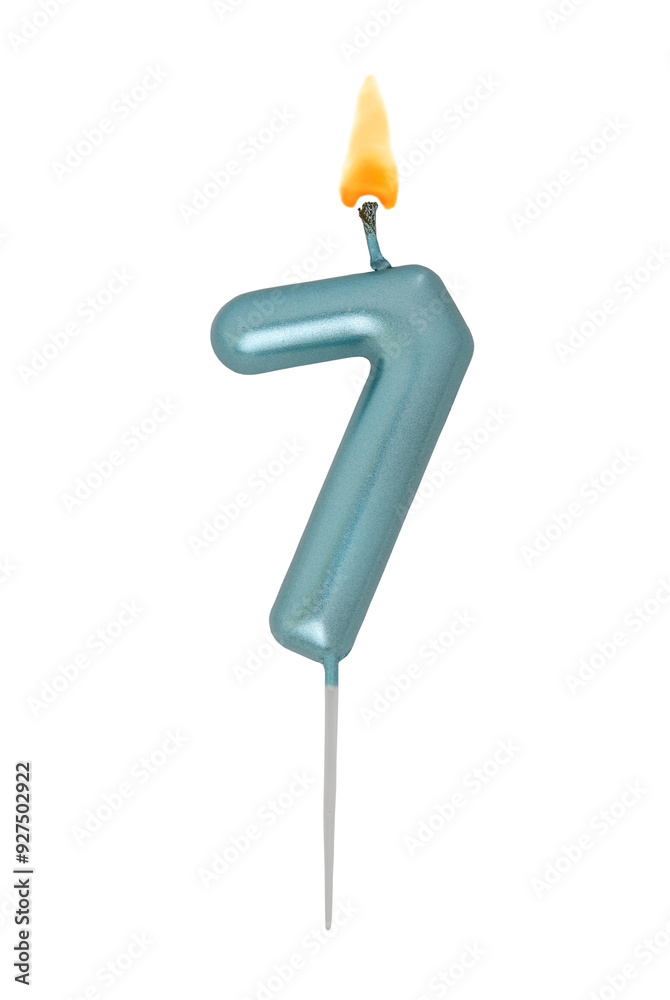 Burning blue birthday candle isolated on white background, number 7 Burning blue birthday candle isolated on white background, number 7