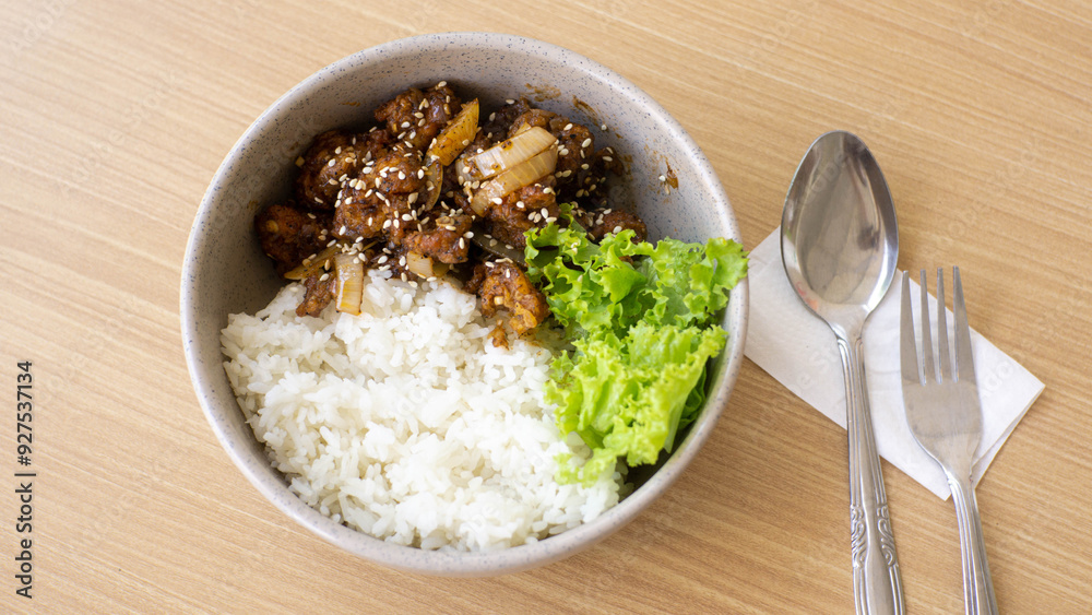 Ricebowl Beef Barbeque in a white bowl on a natural wood color table Ricebowl Beef Barbeque in a white bowl on a natural wood color table
